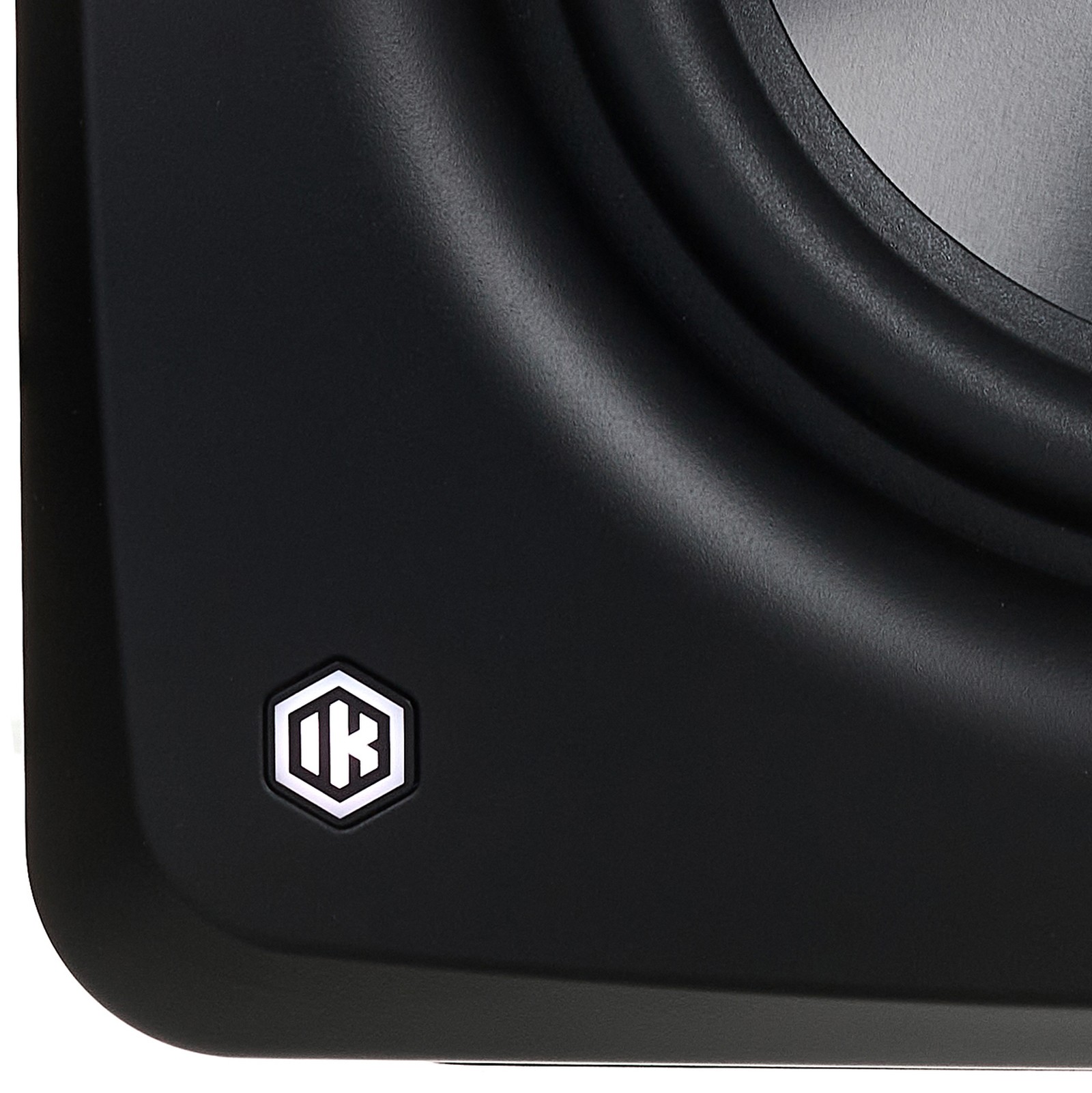 Manufacturer's logo on the IK Multimedia iLoud Sub, self-calibrating monitor subwoofer