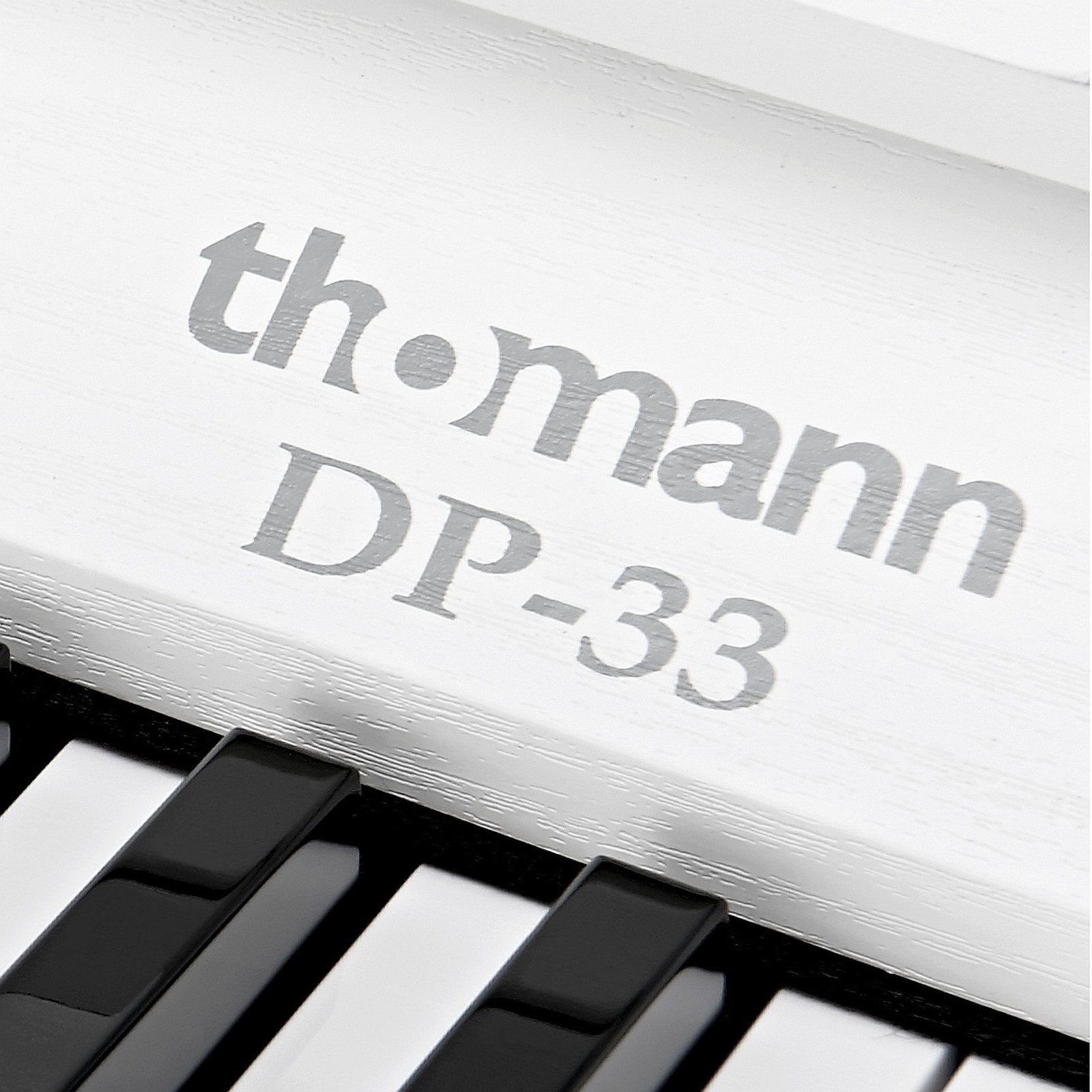 Thomann Logo on the DP-33 WH Compact Digital Piano