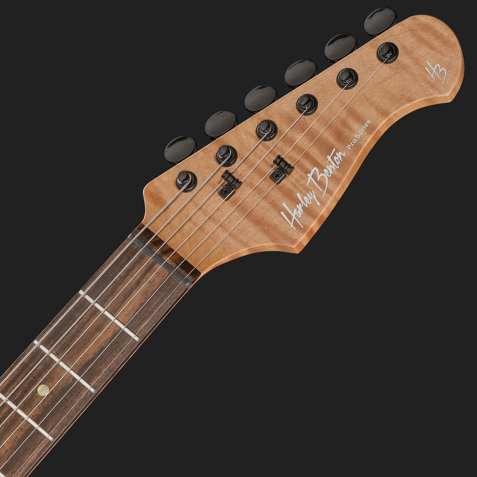 Rosted headstock on the Harley Benton electric guitar made from maple