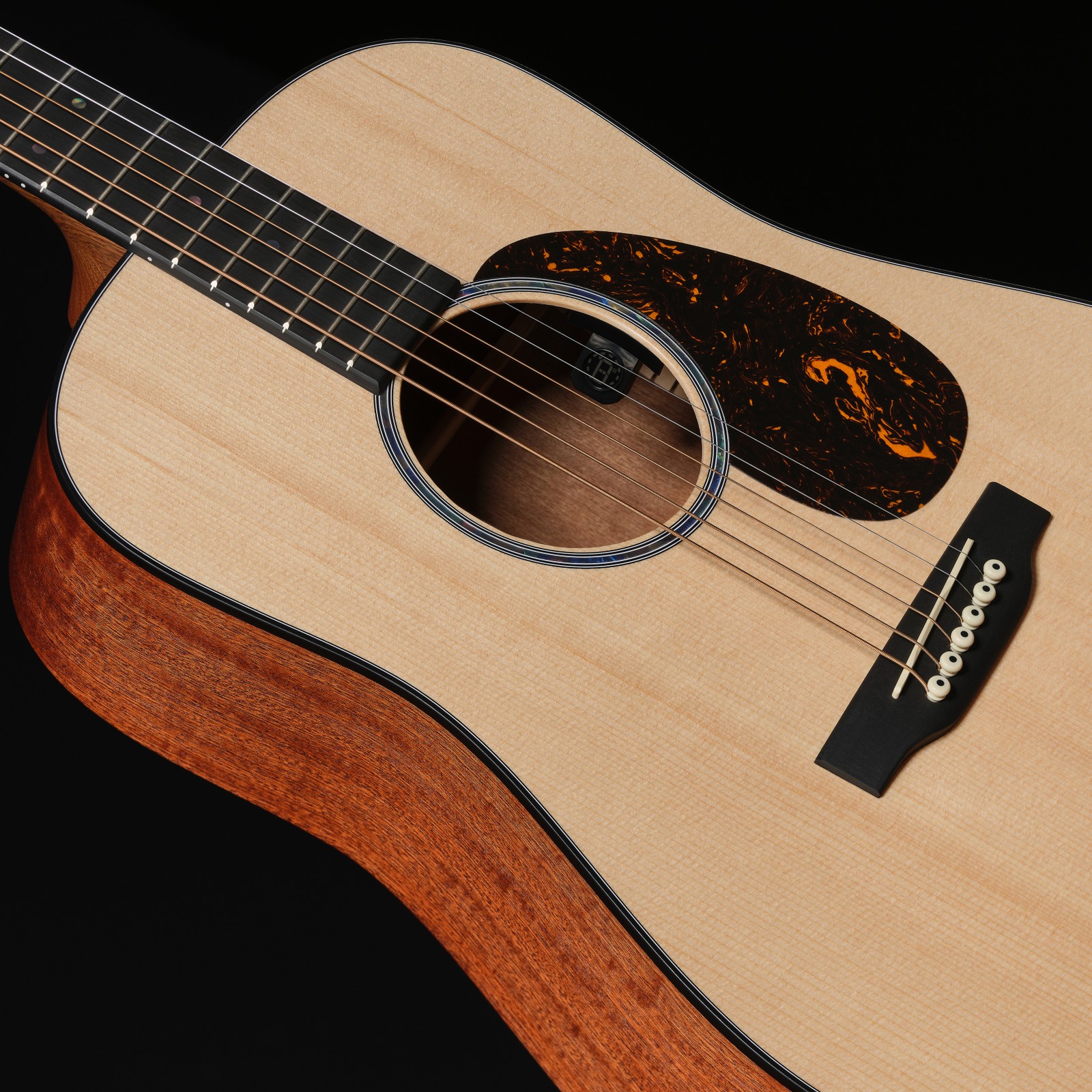 Spruce top of the Martin Guitar D Jr E acoustic guitar