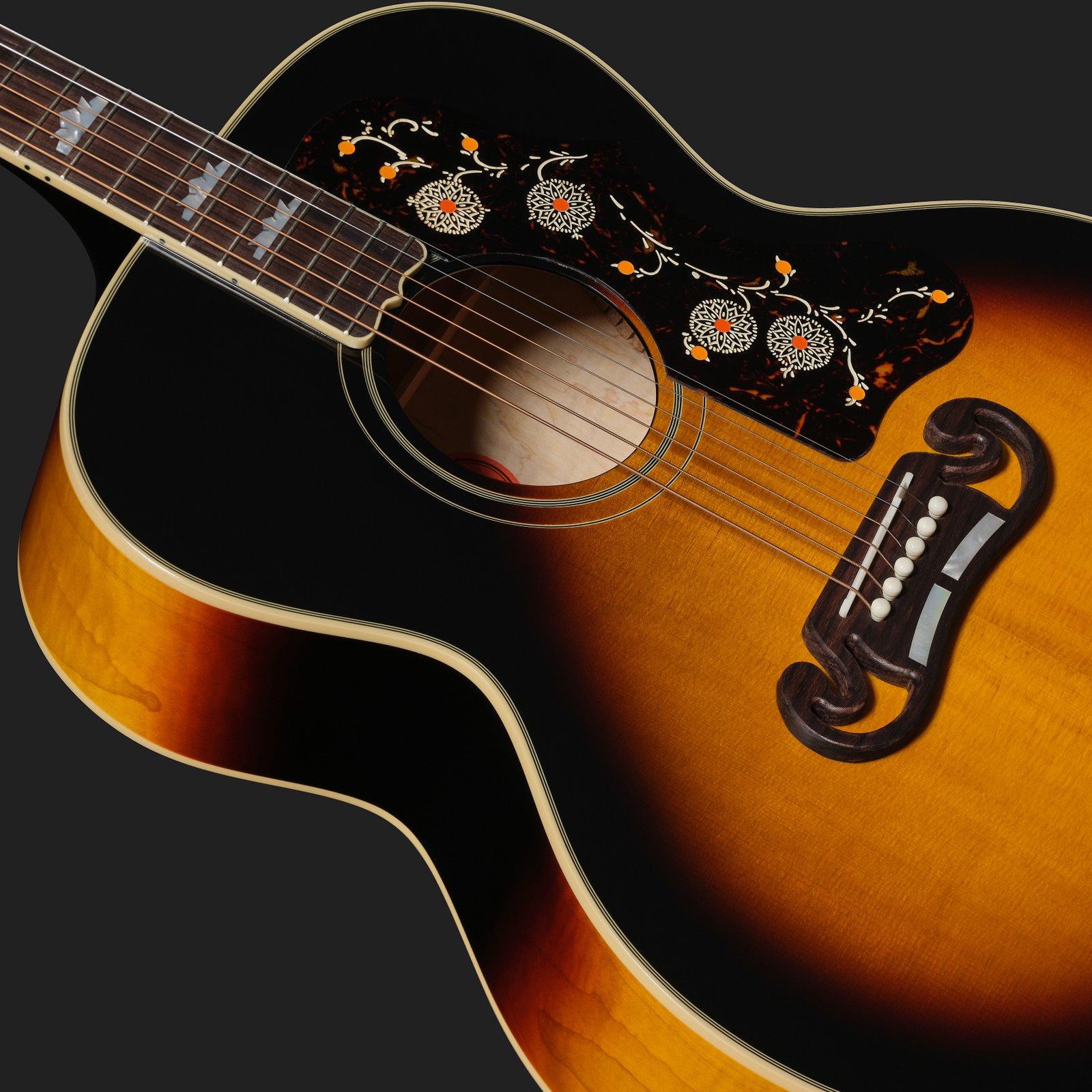 Vintage-style pickguard on the Epiphone 1957 SJ-200 Reissue VS IBC, steel-string acoustic guitar
