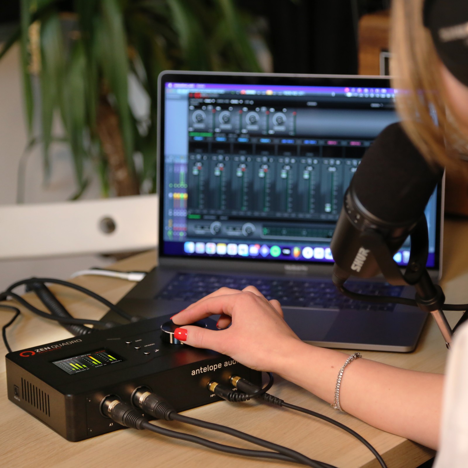Woman produces a podcast using the Antelope Zen Quadro Synergy Core