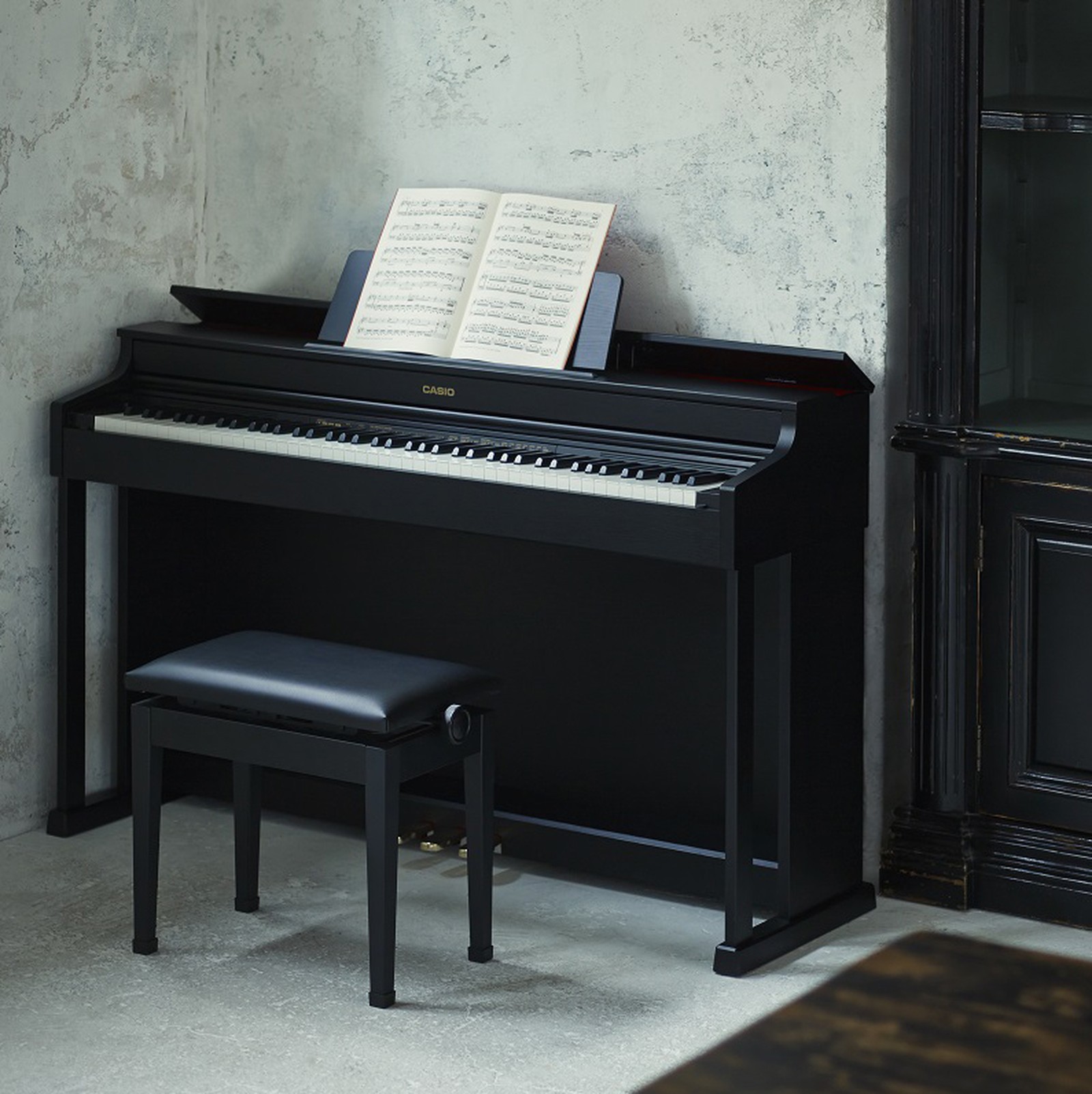 Black Casio AP-470 BK Celviano digital piano standing in a room