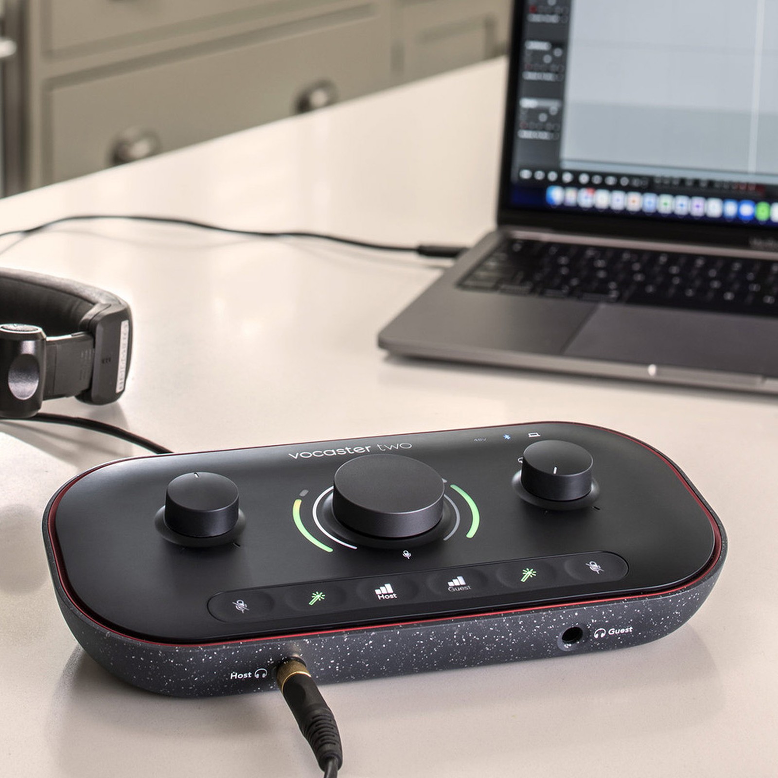 Focusrite Vocaster Two in front of a Macbook laptop